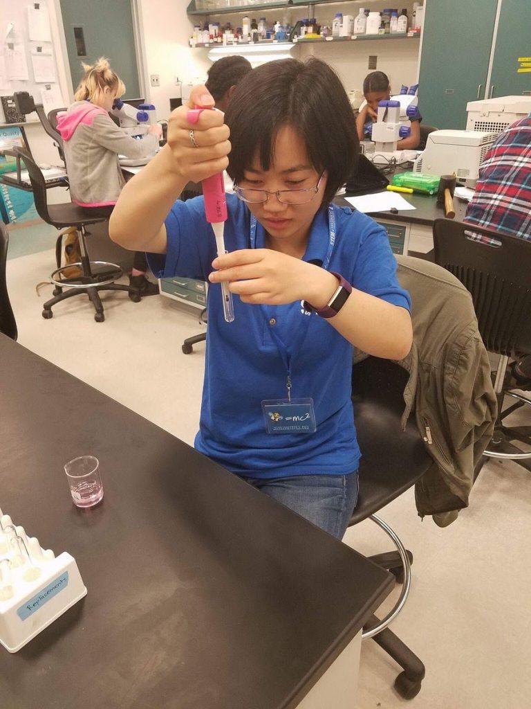 A student uses a pipette in a laboratory classroom